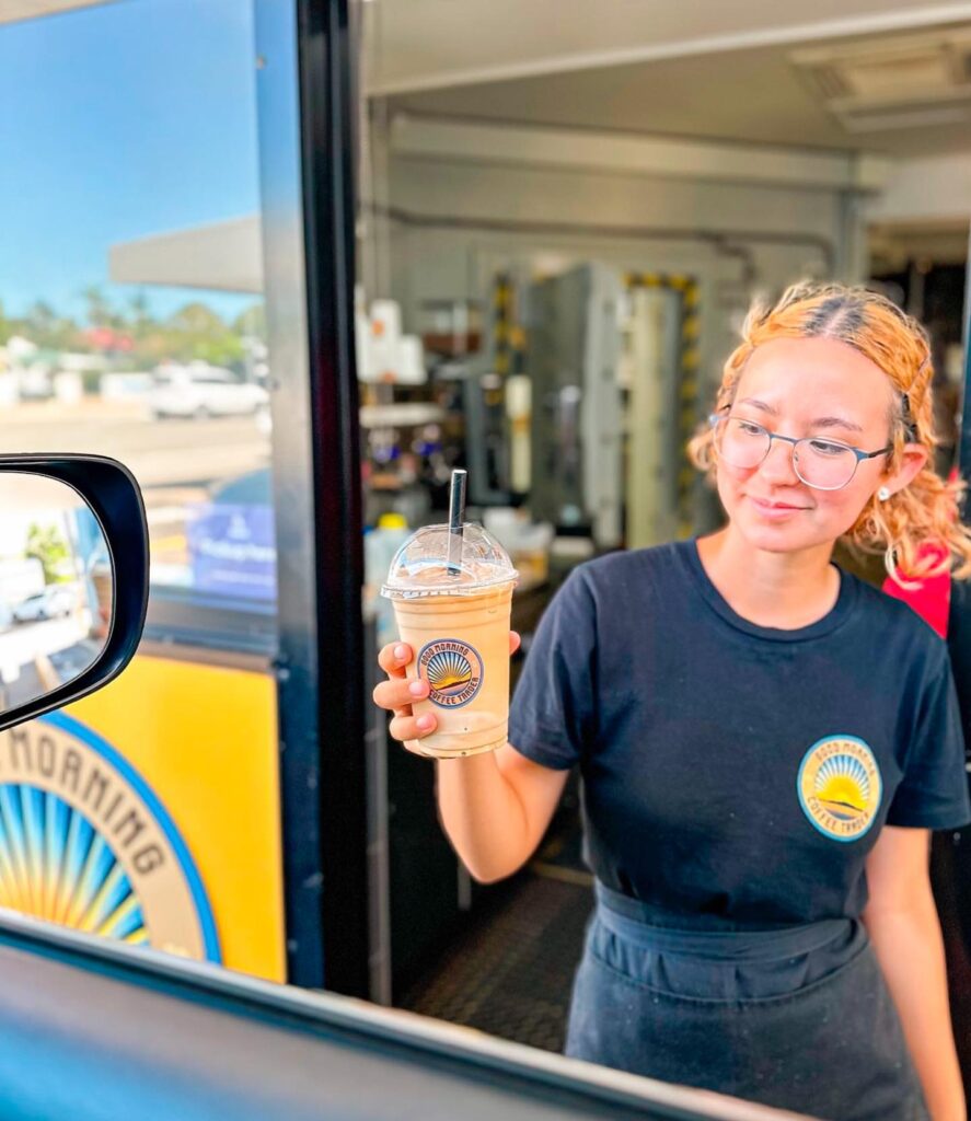 woman holding a milkshake